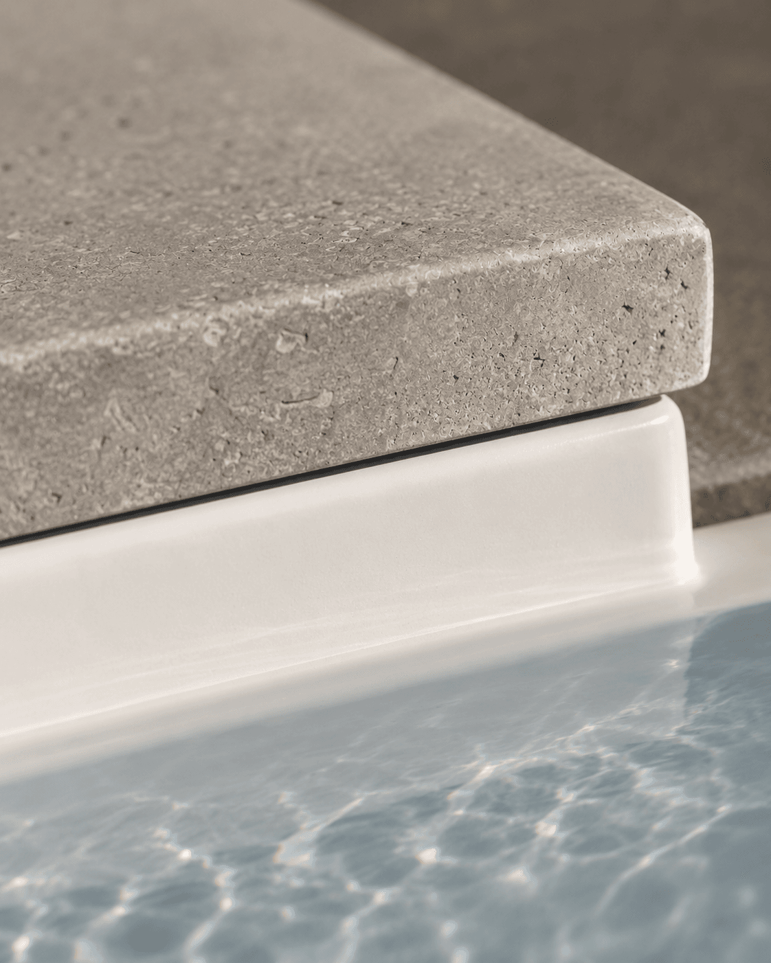 Limestone coping and fiberglass pool shell detail, inground pool installation, Pristine Pools Guelph