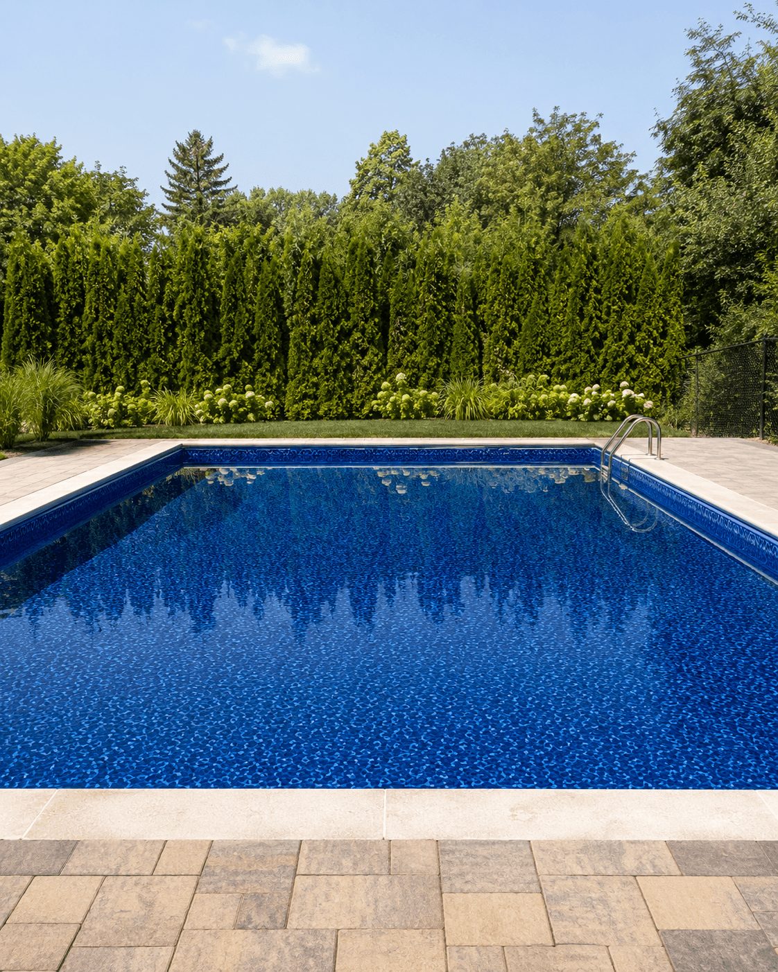 Vinyl liner replacement navy mosaic pool Wellington County Completed vinyl liner replacement with navy mosaic liner Wellington County Ontario